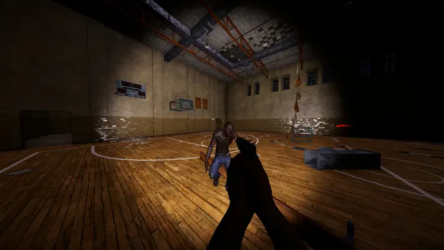 First-person view in a dark indoor basketball court